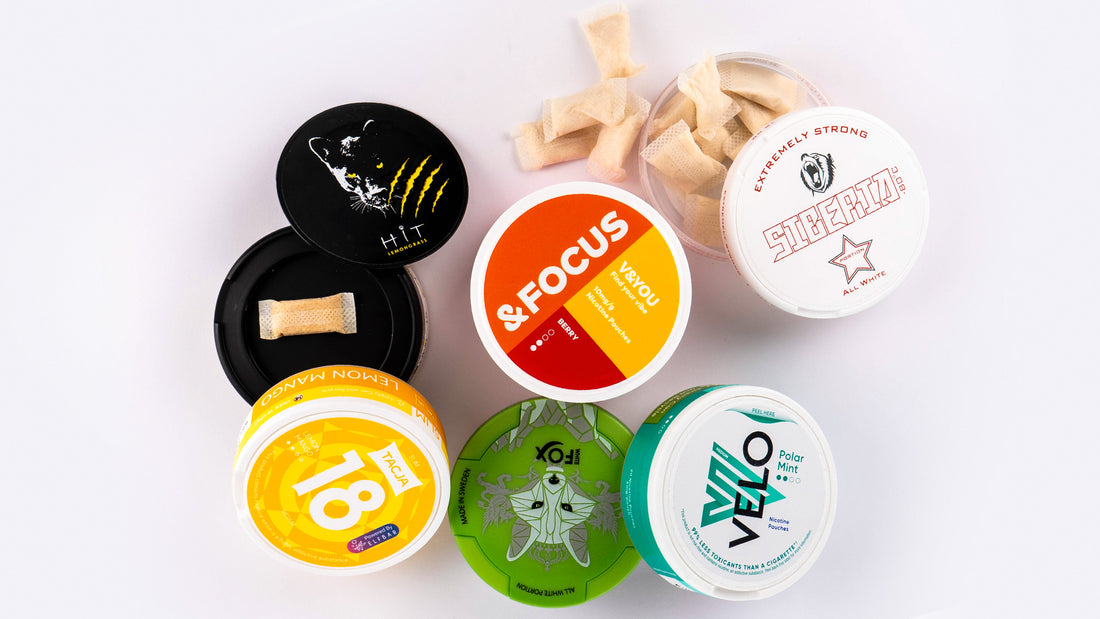 A picture showing a selection of nicotine pouch tubs.